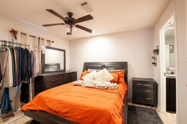 a bedroom with a bed and a closet