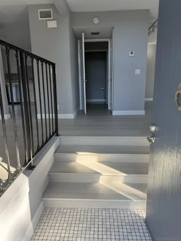 a view of entryway with a bathtub