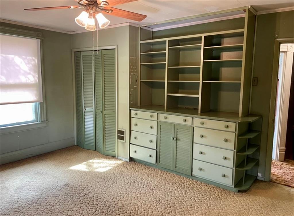 424 Deer Lane Rochester, PA 15074 - Photo 13 of 20 a view of a bedroom with cabinet and windows