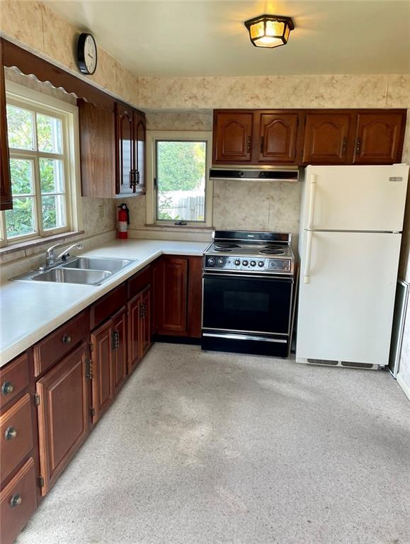 424 Deer Lane Rochester, PA 15074 - Photo 8 of 20 a kitchen with stainless steel appliances granite countertop a sink stove and microwave