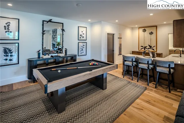 a living room with furniture pool and a table