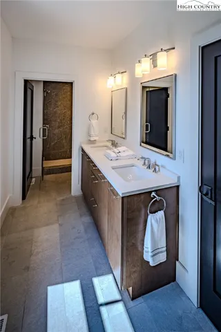 a bathroom with a sink and mirror