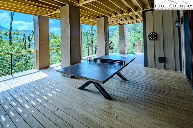 a view of a patio with wooden floor