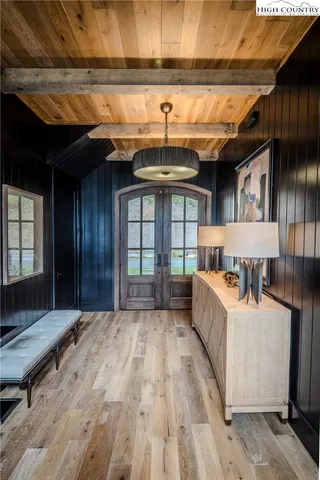 a bed room with a bed and a large window