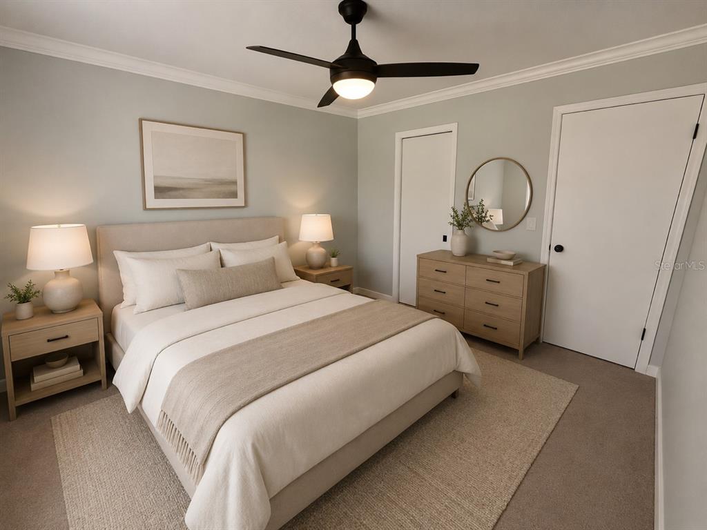 9801 Southeast Sunset Harbor Road Summerfield, FL 34491 - Photo 13 of 37 a bedroom with bed and a chandelier