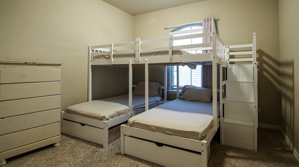 9917 Bodega Bay Road Fort Worth, TX 76177 - Photo 13 of 18 a room with a bed and a mirror