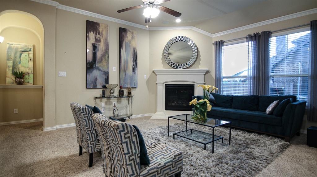 9917 Bodega Bay Road Fort Worth, TX 76177 - Photo 5 of 18 a living room with furniture and a fireplace