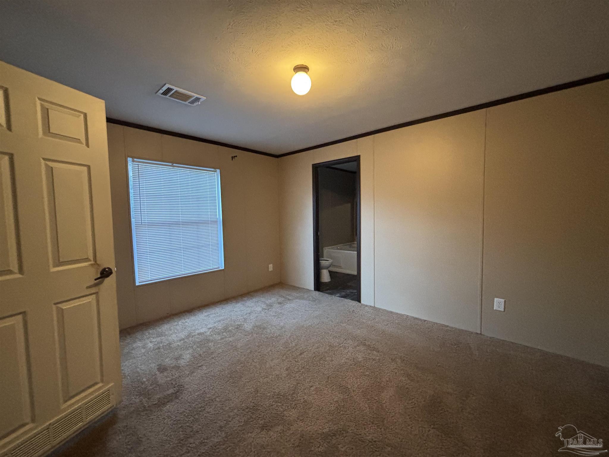 6261 Morgan Road Milton, FL 32570 - Photo 3 of 8 an empty room with windows