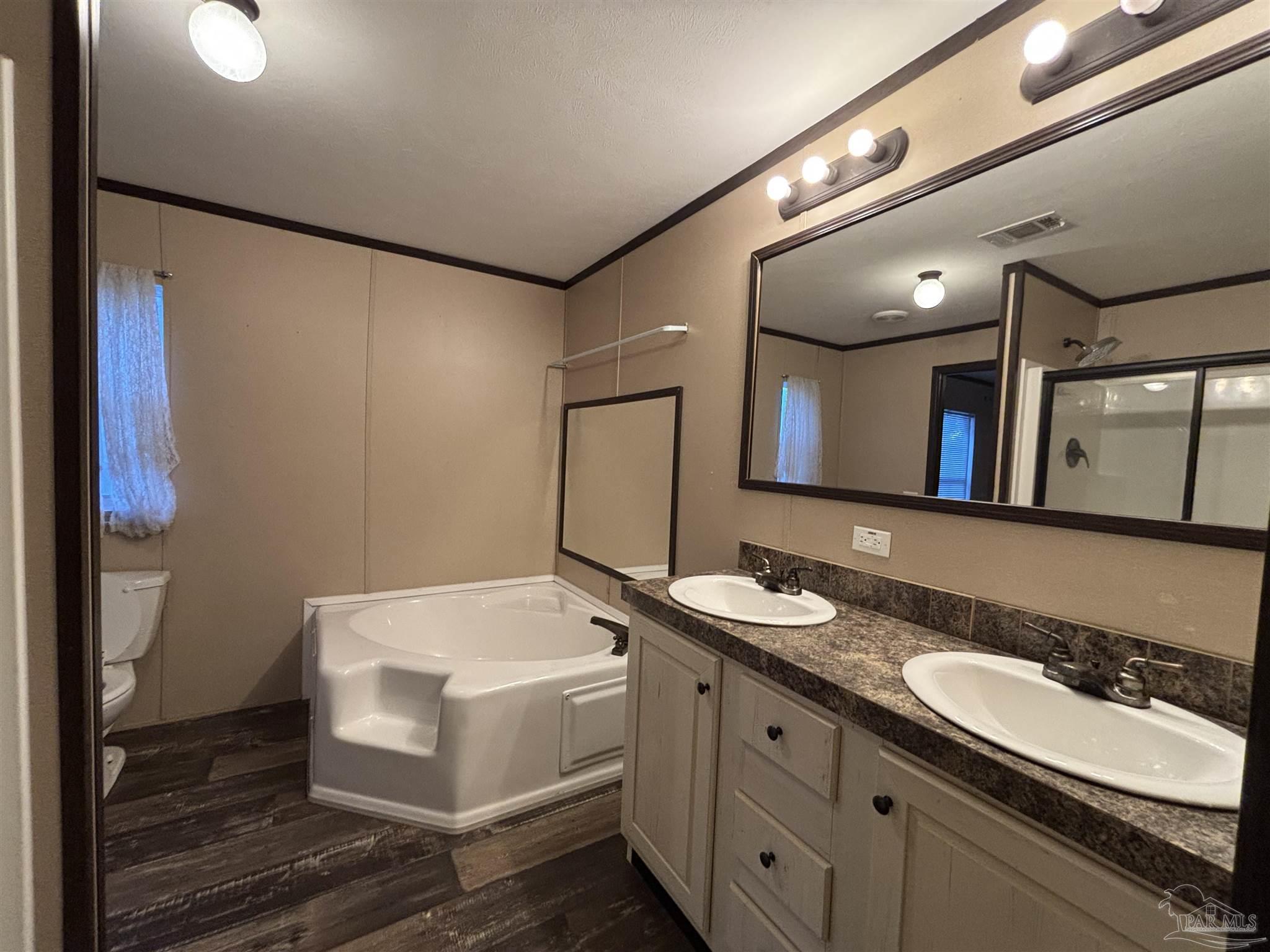 6261 Morgan Road Milton, FL 32570 - Photo 5 of 8 a bathroom with a sink and a mirror