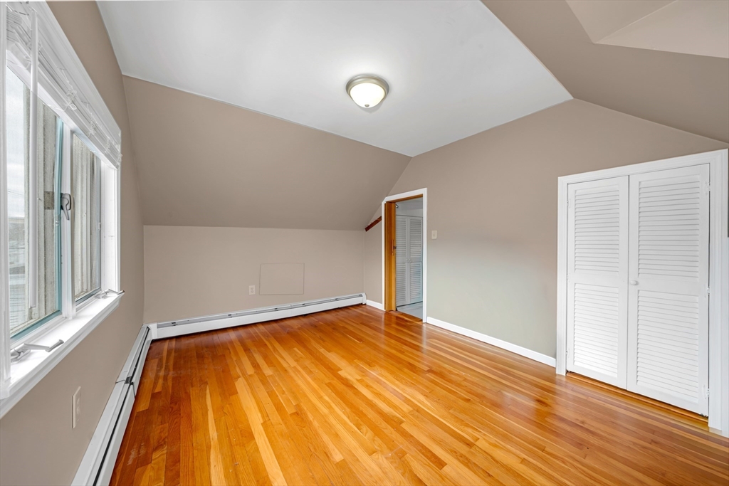 73 Waterhill Street Lynn, MA 01905 - Photo 15 of 33 a view of empty room with wooden floor