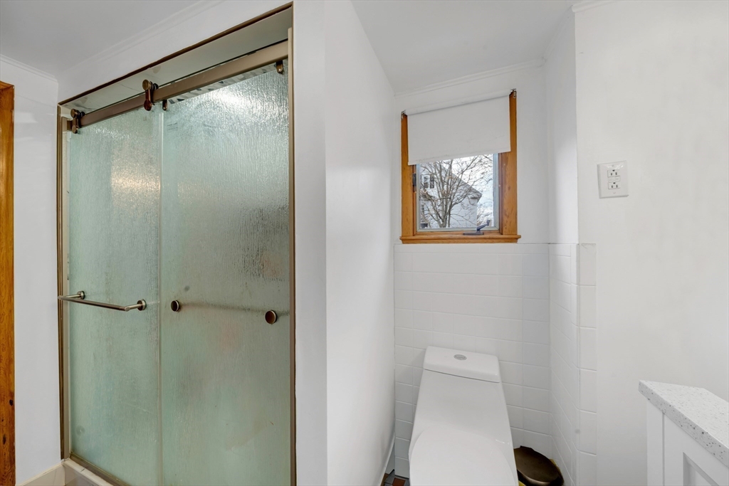 73 Waterhill Street Lynn, MA 01905 - Photo 19 of 33 a bathroom with a shower and a toilet