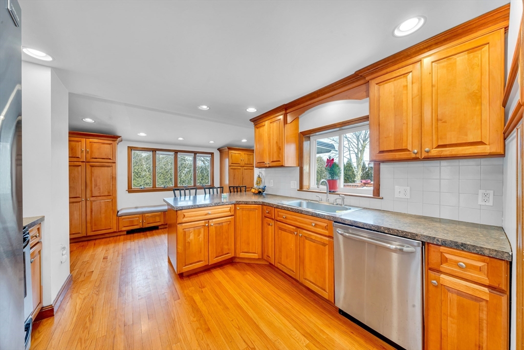73 Waterhill Street Lynn, MA 01905 - Photo 2 of 33 a large kitchen with stainless steel appliances granite countertop a large window a sink and a counter space
