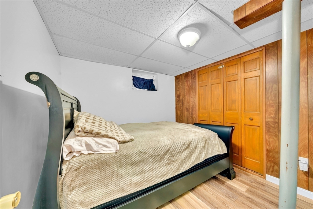 73 Waterhill Street Lynn, MA 01905 - Photo 22 of 33 a bedroom with a bed and a window
