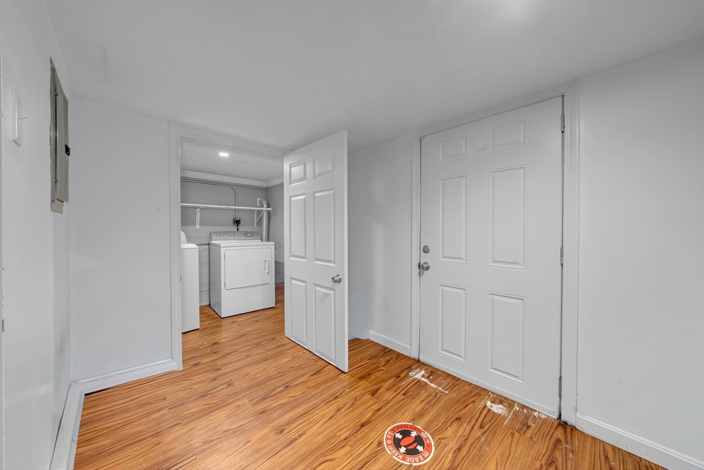 73 Waterhill Street Lynn, MA 01905 - Photo 26 of 33 a bedroom with a bed and a view of bathroom