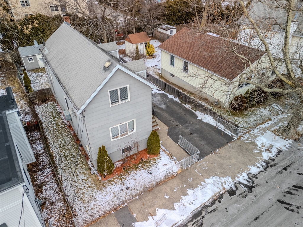 73 Waterhill Street Lynn, MA 01905 - Photo 30 of 33 a house with trees in front of it