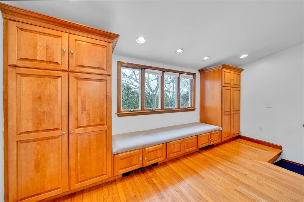73 Waterhill Street Lynn, MA 01905 - Photo 3 of 33 a view of an empty room with a window and wooden floor