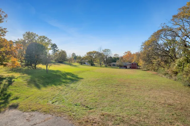 a view of a lake with a yard