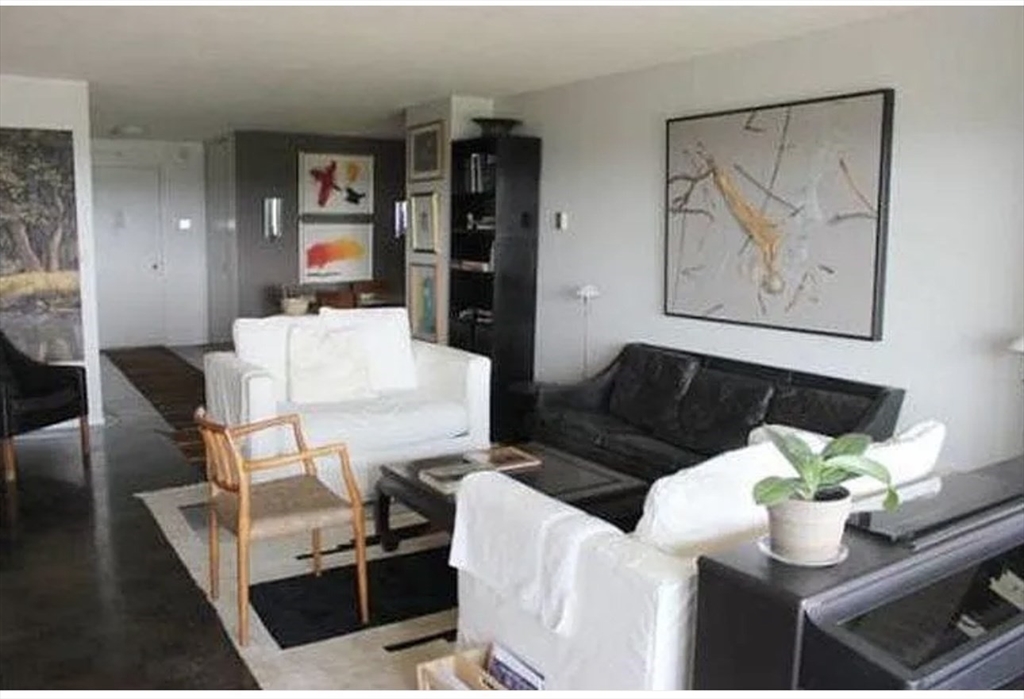 111 Perkins Street, Unit 108 Boston, MA 02130 - Photo 3 of 11 a living room with furniture and wooden floor