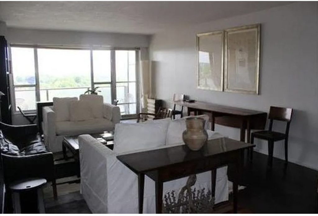 111 Perkins Street, Unit 108 Boston, MA 02130 - Photo 4 of 11 a living room with furniture and a large window