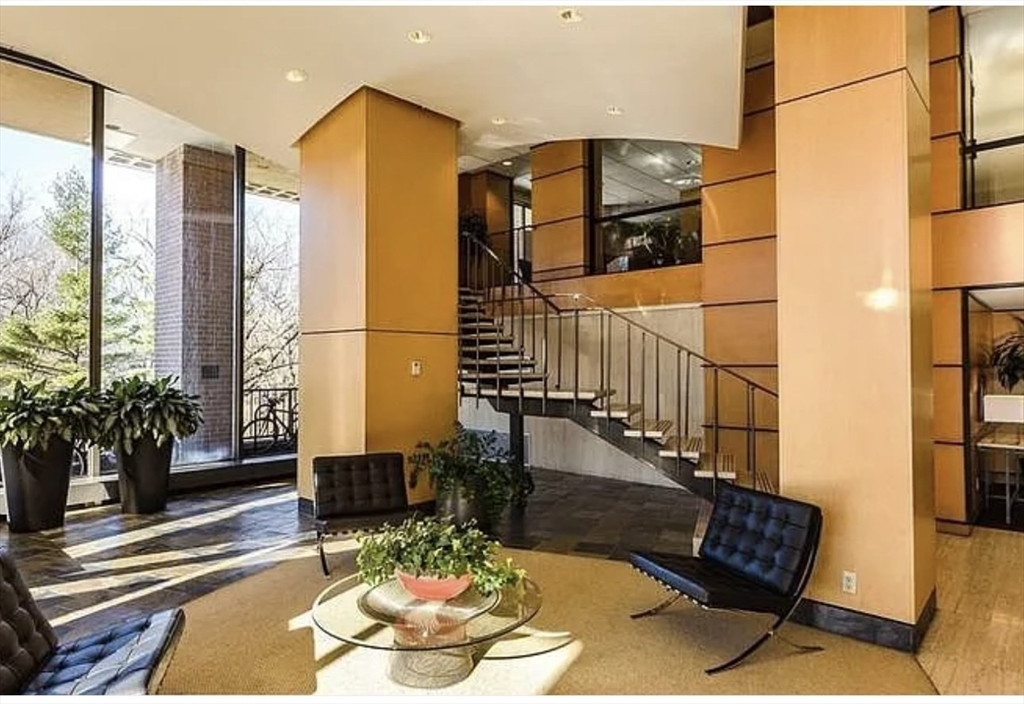 111 Perkins Street, Unit 108 Boston, MA 02130 - Photo 7 of 11 a living room with furniture and a potted plant