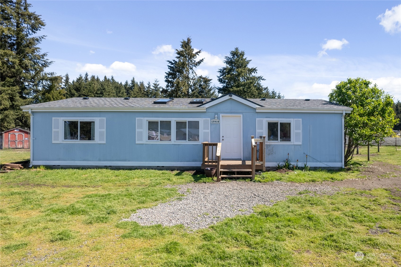 17910 Michelles Lane Southwest Rochester, WA 98579 - Photo 1 of 35 a backyard of a house with table and chairs