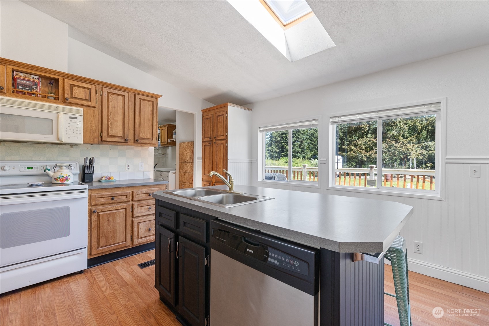 17910 Michelles Lane Southwest Rochester, WA 98579 - Photo 11 of 35 a kitchen with stainless steel appliances granite countertop a sink stove and cabinets