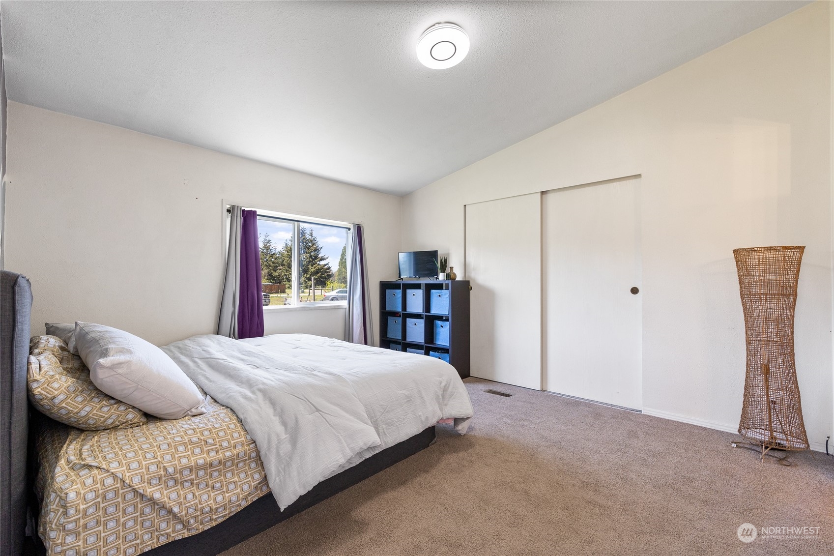 17910 Michelles Lane Southwest Rochester, WA 98579 - Photo 13 of 35 a bedroom with a bed and a window