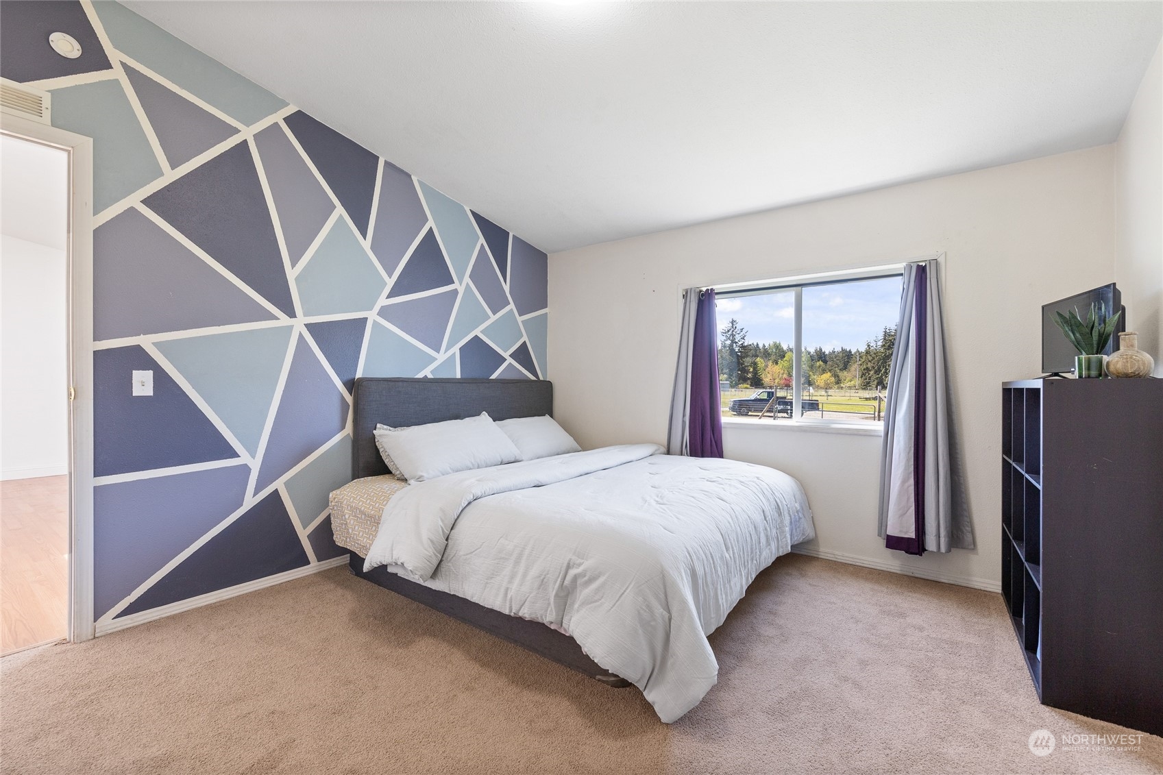 17910 Michelles Lane Southwest Rochester, WA 98579 - Photo 14 of 35 a bedroom with a bed and a painting on the wall