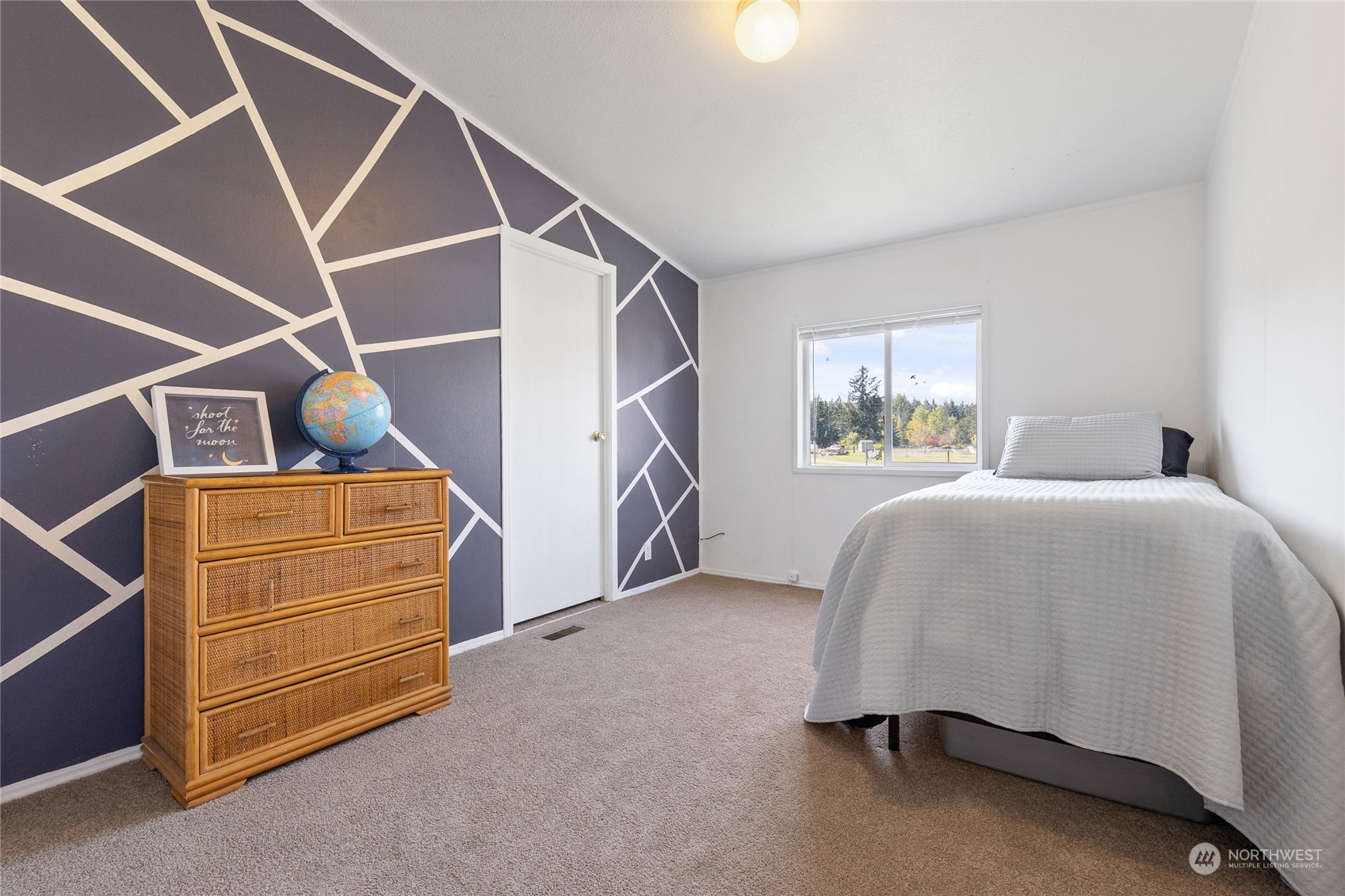 17910 Michelles Lane Southwest Rochester, WA 98579 - Photo 17 of 35 a bedroom with a bed and a window