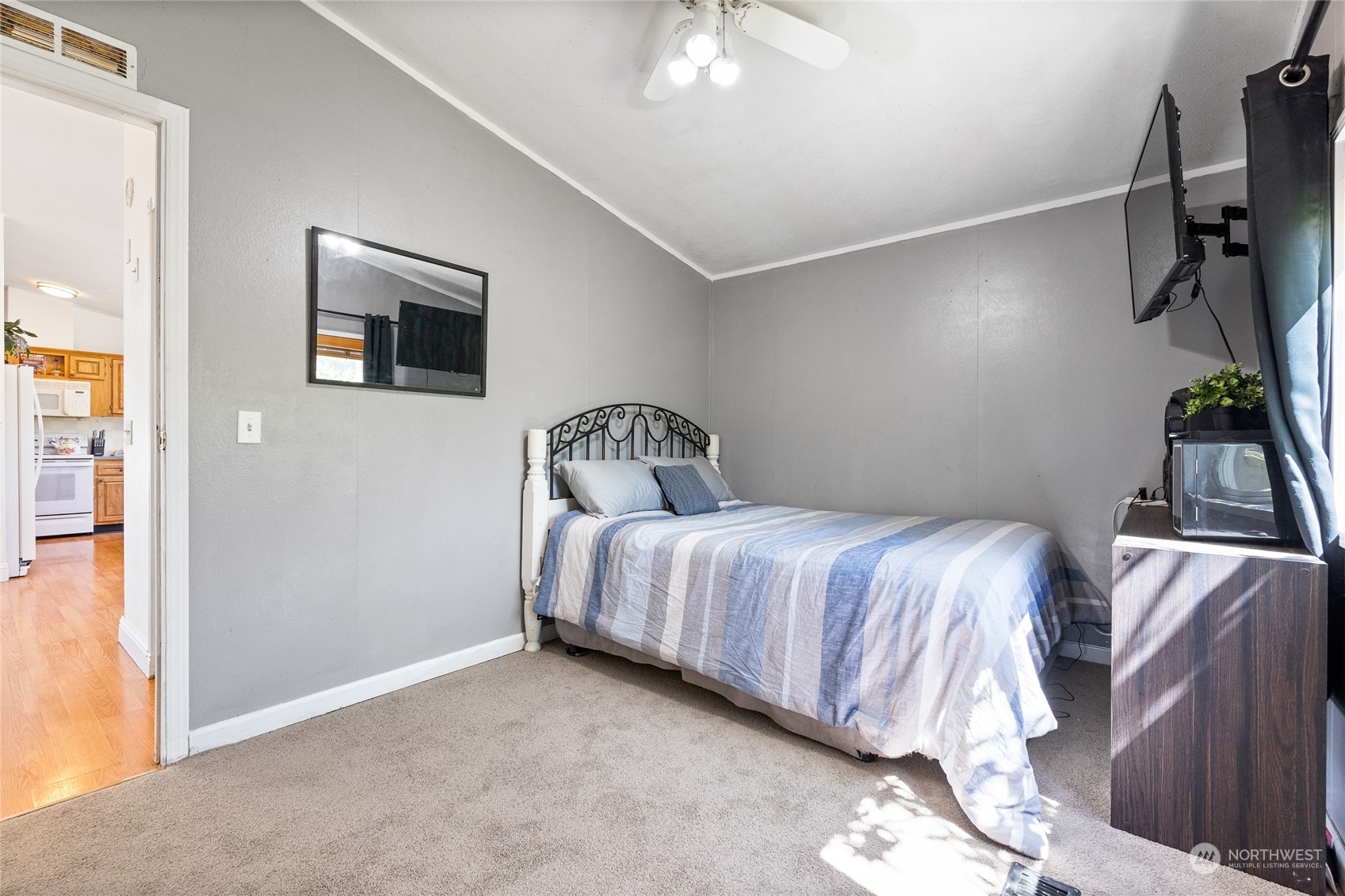 17910 Michelles Lane Southwest Rochester, WA 98579 - Photo 19 of 35 a bedroom with a bed and flowerpot