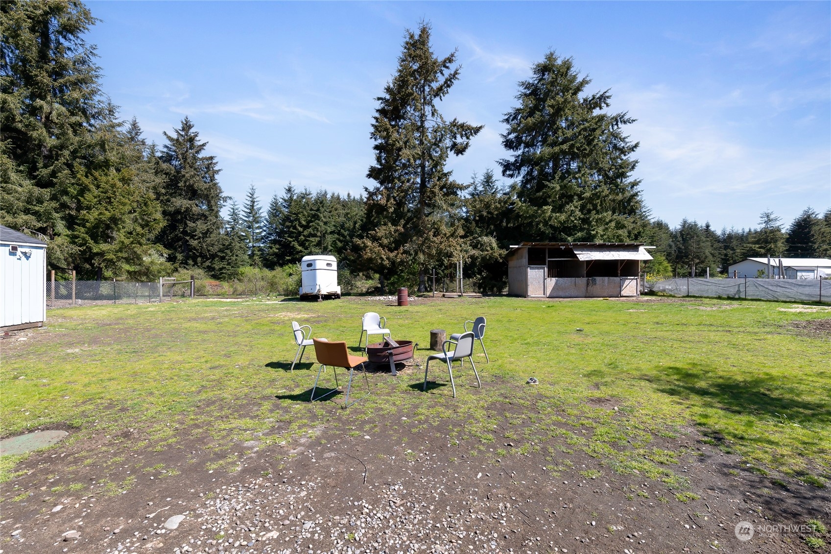17910 Michelles Lane Southwest Rochester, WA 98579 - Photo 23 of 35 a view of a house with backyard porch and sitting area