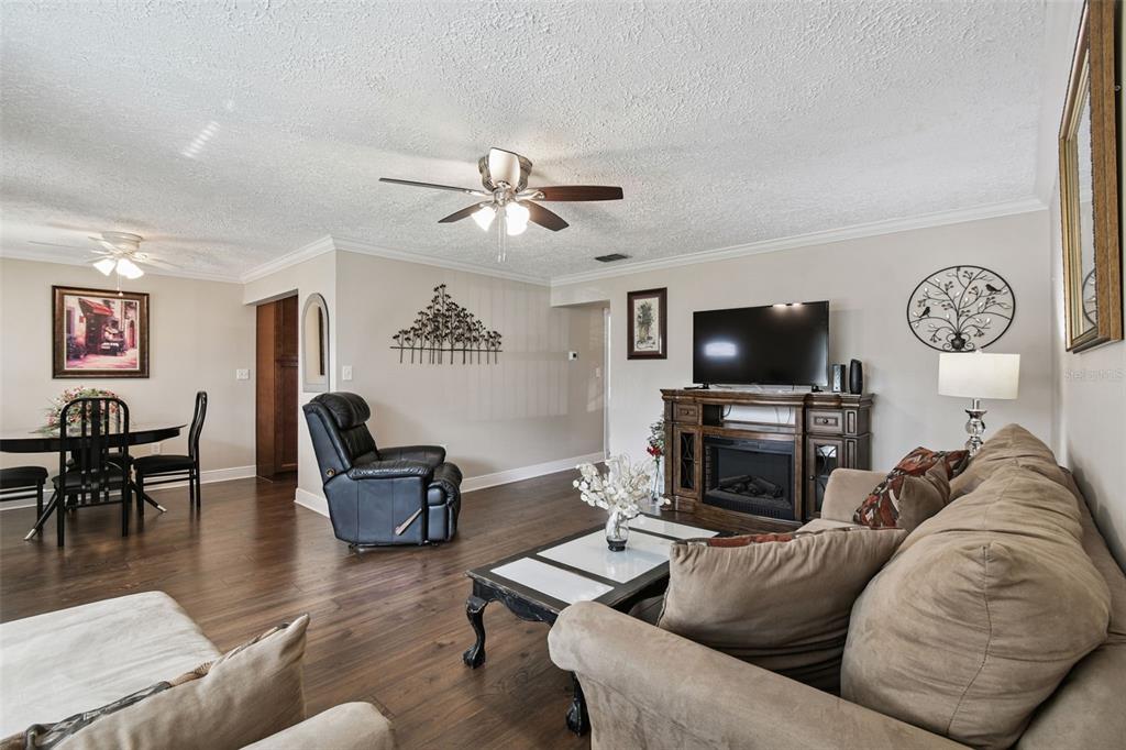 11902 Boynton Lane New Port Richey, FL 34654 - Photo 13 of 44 a living room with furniture and a flat screen tv