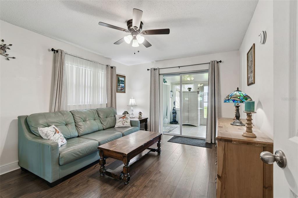 11902 Boynton Lane New Port Richey, FL 34654 - Photo 15 of 44 a living room with furniture and a large window