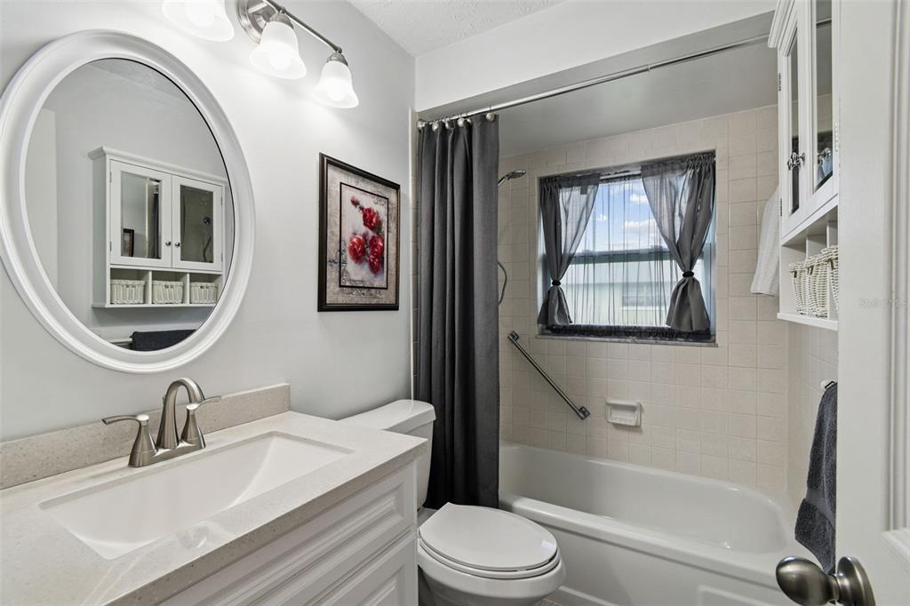 11902 Boynton Lane New Port Richey, FL 34654 - Photo 16 of 44 a bathroom with a toilet a sink and a bathtub