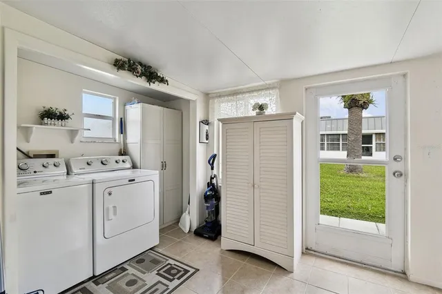 a room with a baby crib and a glass door shower