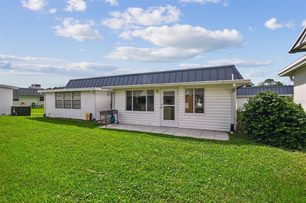 11902 Boynton Lane New Port Richey, FL 34654 - Photo 26 of 44 a view of a house with a backyard