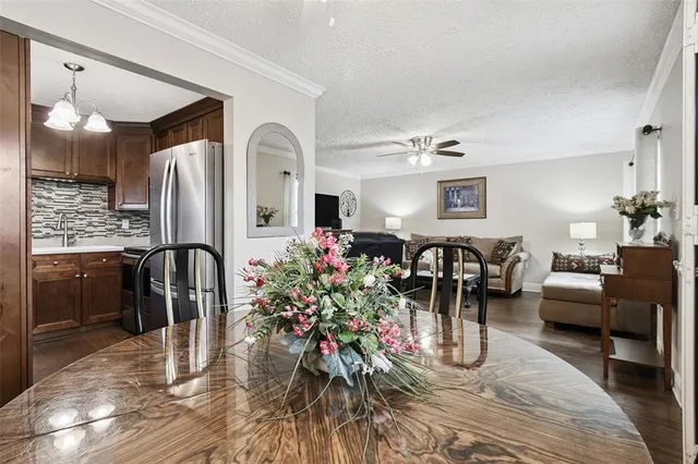 a very nice looking living room with wooden floor and furniture