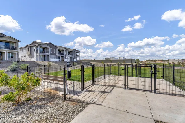 a view of a lake with a yard and a ocean view