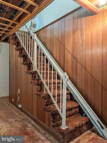 a view of staircase with wooden floor and stairs