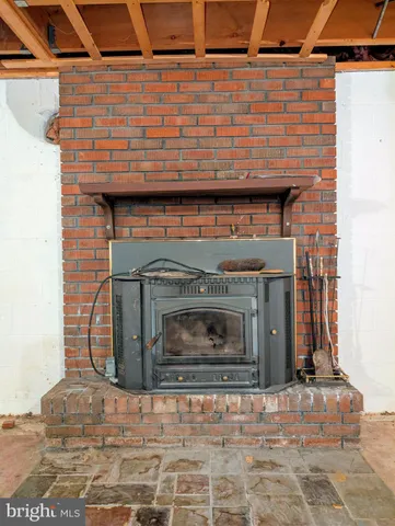 a fireplace with a wooden floor