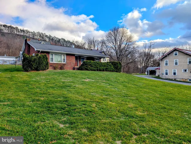 a view of a house with a big yard