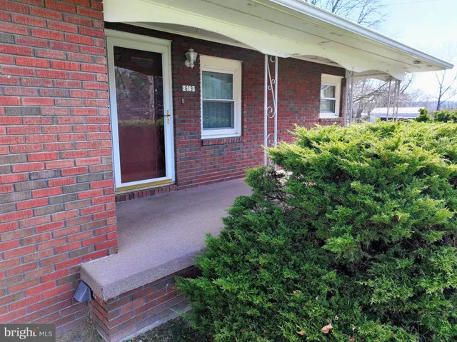 a view of a bench in front of door