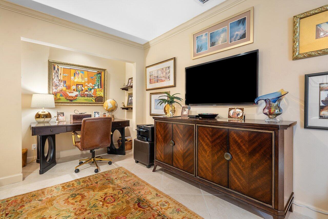 5158 Windsor Parke Drive Boca Raton, FL 33496 - Photo 12 of 44 a living room with furniture and a flat screen tv
