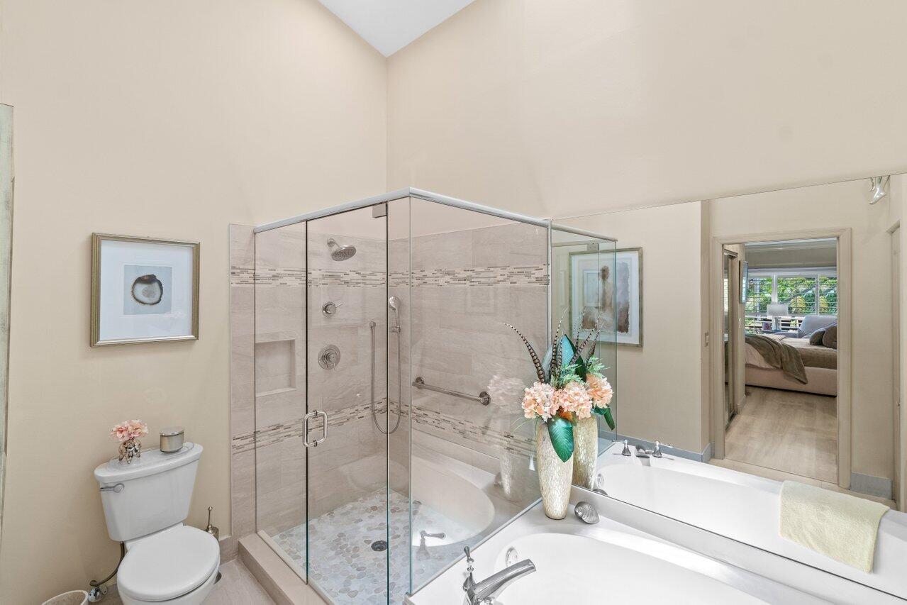 5158 Windsor Parke Drive Boca Raton, FL 33496 - Photo 17 of 44 a bathroom with a shower and a toilet