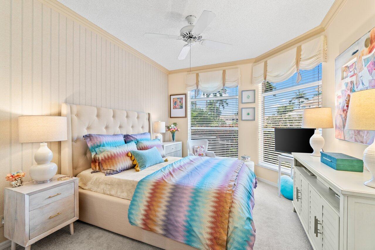 5158 Windsor Parke Drive Boca Raton, FL 33496 - Photo 8 of 44 a bedroom with a bed wooden floor and window