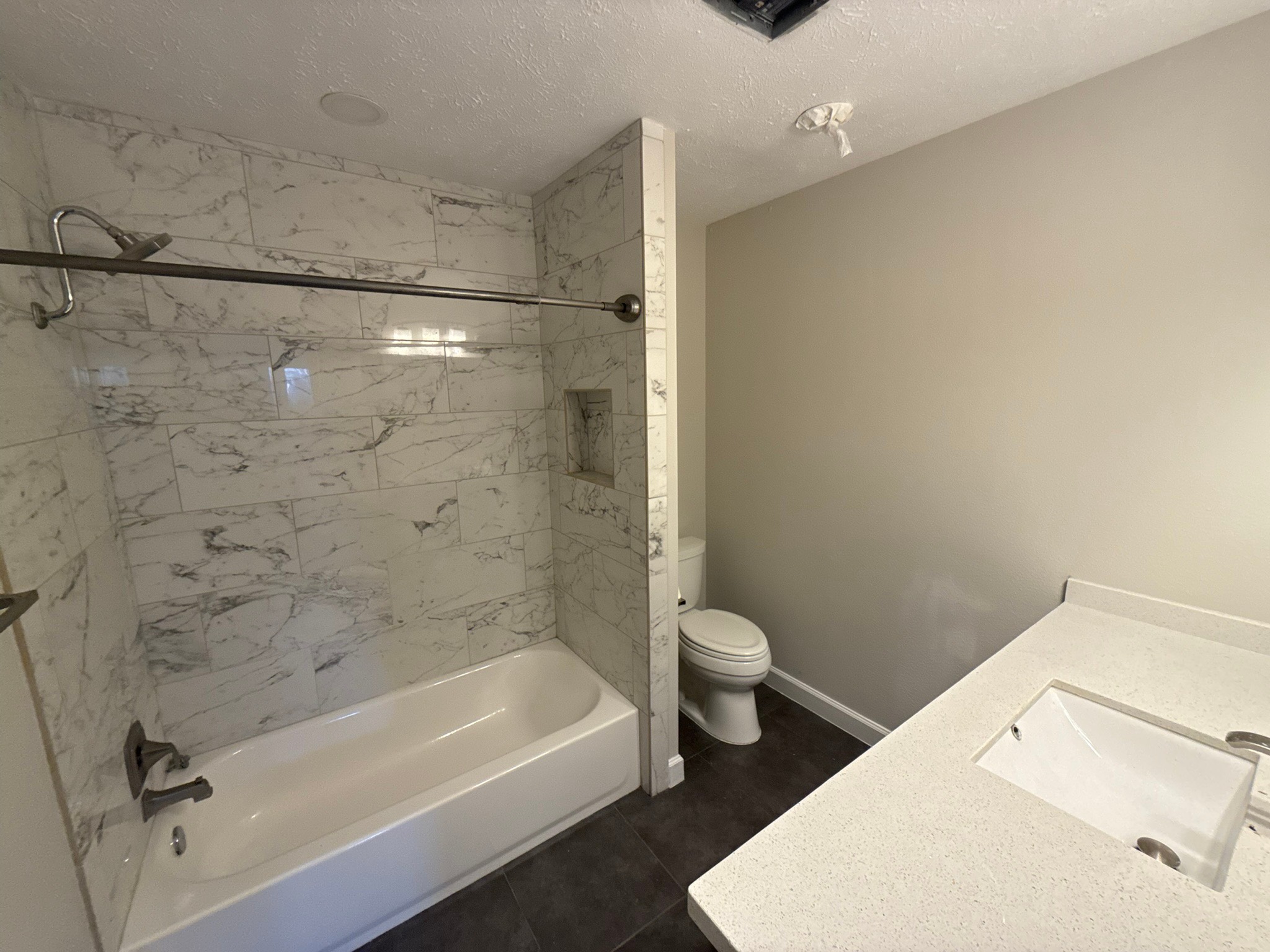 10130 Sagedale Drive Houston, TX 77089 - Photo 26 of 36 a bathroom with a bathtub and a toilet