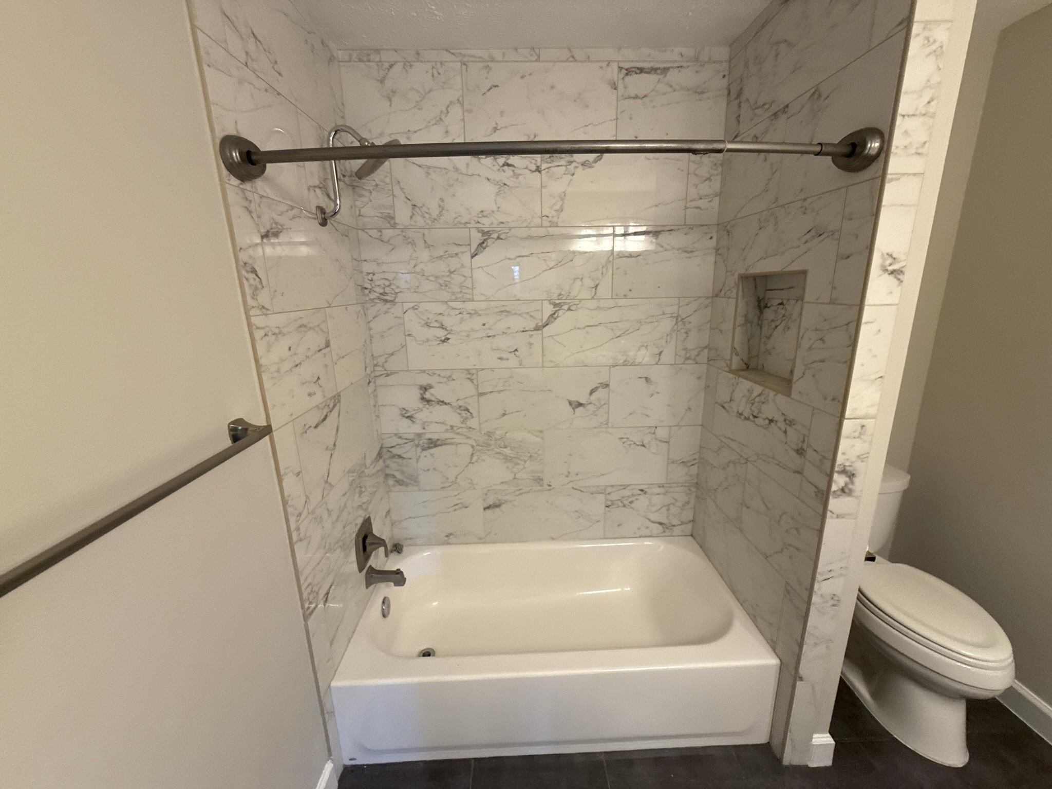 10130 Sagedale Drive Houston, TX 77089 - Photo 27 of 36 a bathroom with a bathtub and a toilet