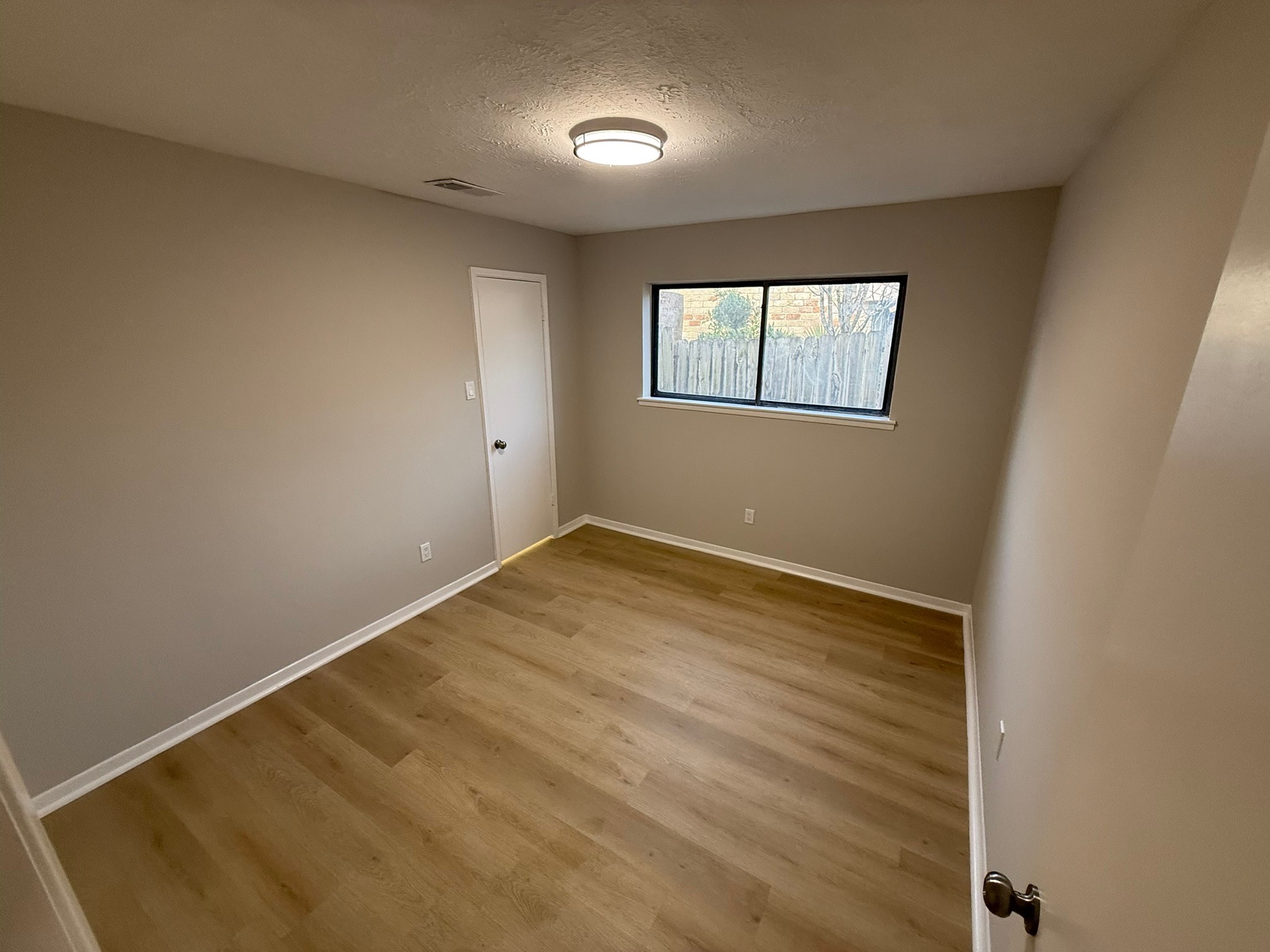 10130 Sagedale Drive Houston, TX 77089 - Photo 30 of 36 an empty room with a window