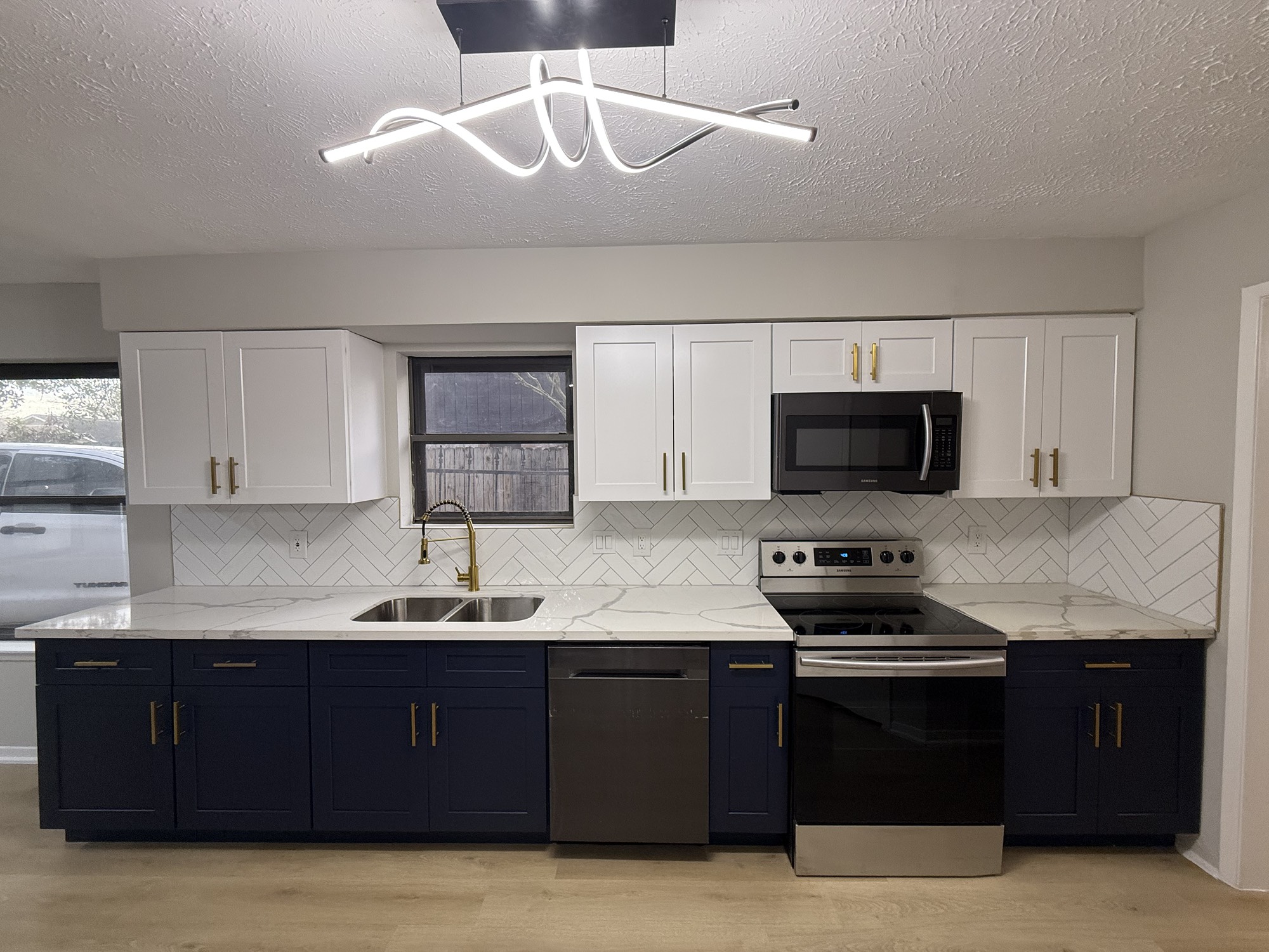 10130 Sagedale Drive Houston, TX 77089 - Photo 6 of 36 a kitchen with a sink appliances and cabinets