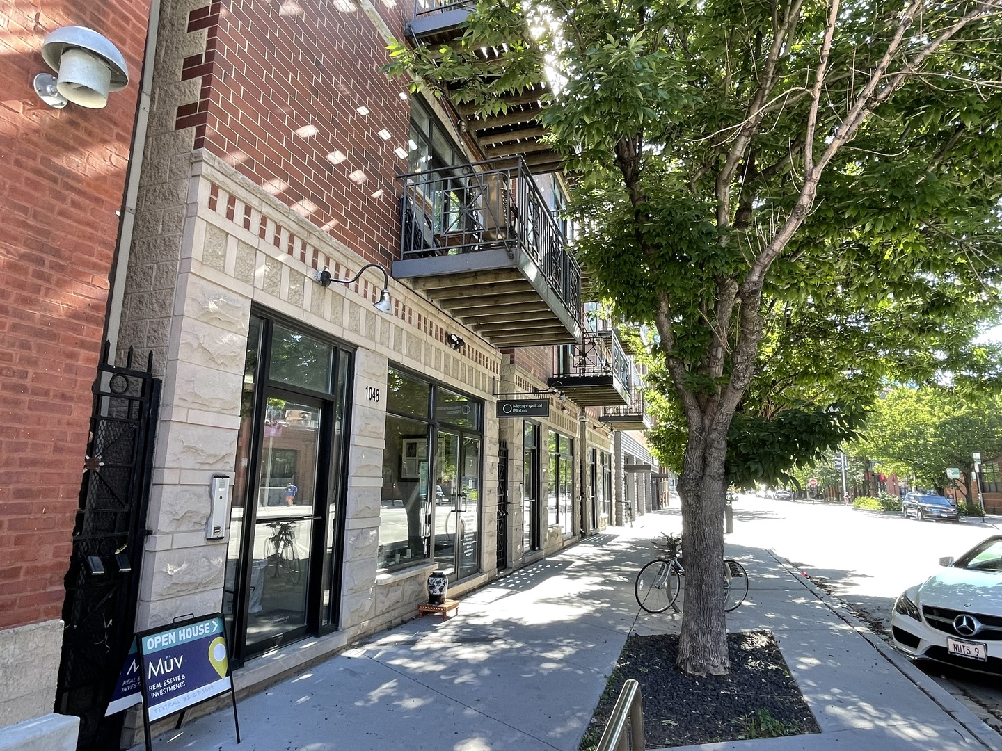 a view of a street with sitting area